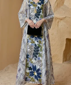 Alternative view of فيفيتش - فستان ماكسي أبيض مطبوع بالكامل، بياقة على شكل حرف V وأكمام طويلة مزين بالترتر