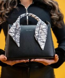 الفي - شنطة نسائية جلد بتصميم غير تقليدي