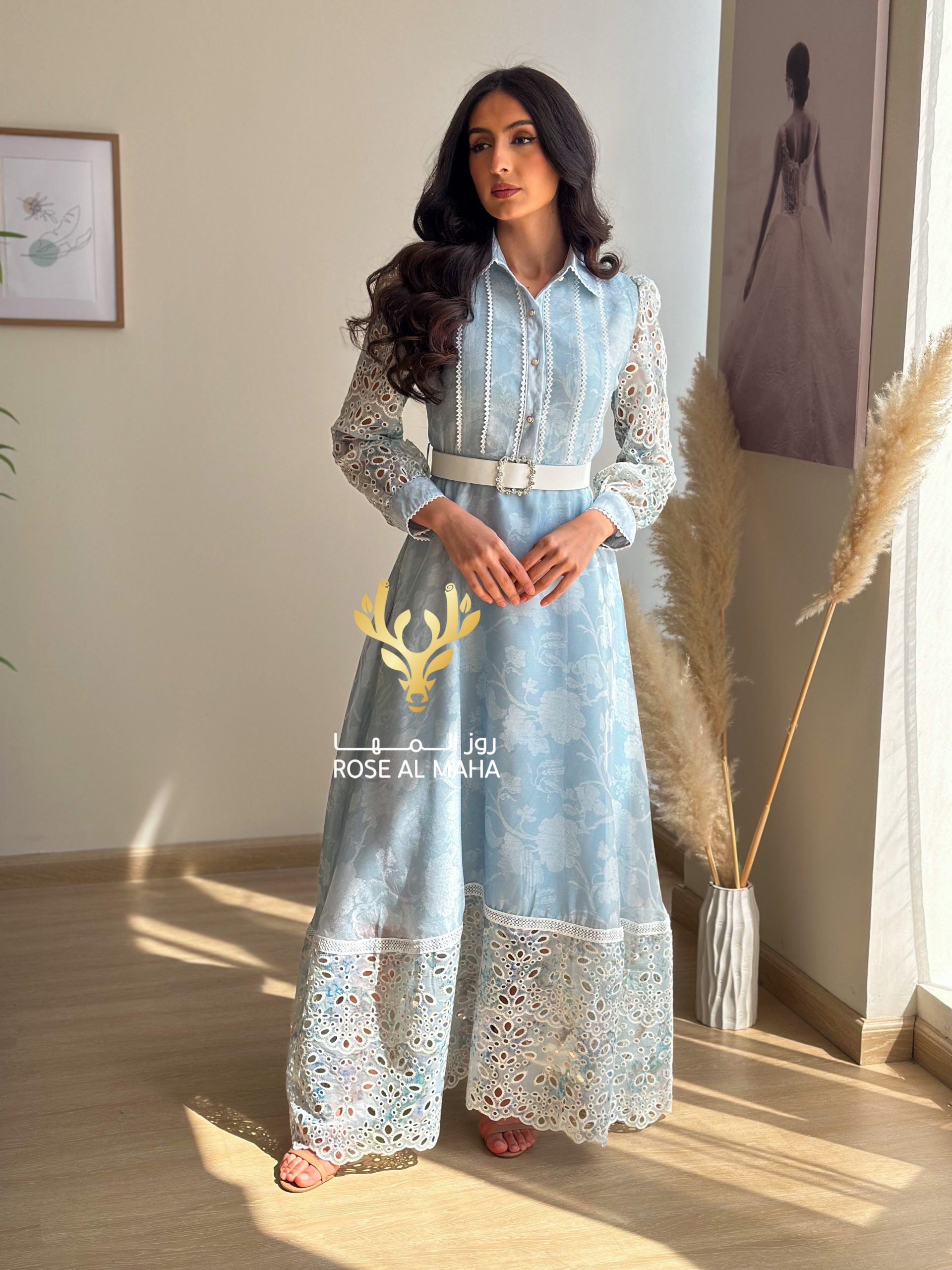 روز المها - فستان بيبي بلو بأكمام جبير