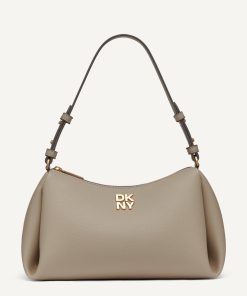 ⁦DKNY - أضيفي لمسة جريئة من الألوان إلى إطلالتك مع حقيبة الكتف "DKNY REMY" ذات السحاب العلوي باللون الأخضر النابض بالحياة.⁩ - الصورة ⁦3⁩